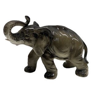 Vintage porcelain elephant figurine, hand-painted, charming decorative piece